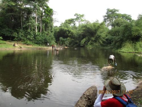 Crossing the Dube River by canoe in Liberia.